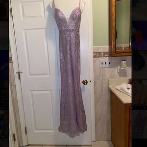 Selling this lilac prom dress.Never been worn,tags still on.Size 0.